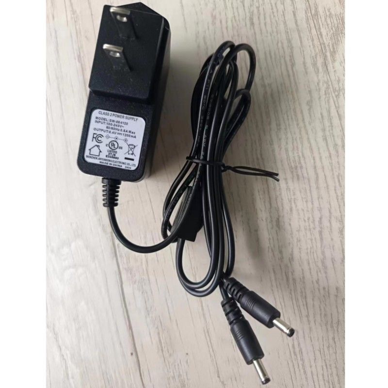Ημερικανικός τυπικός φορτιστής 8.4V 1.2A με δύο κεφαλές συνεχούς ρεύματος για θερμαινόμενη μπαταρία γάντι